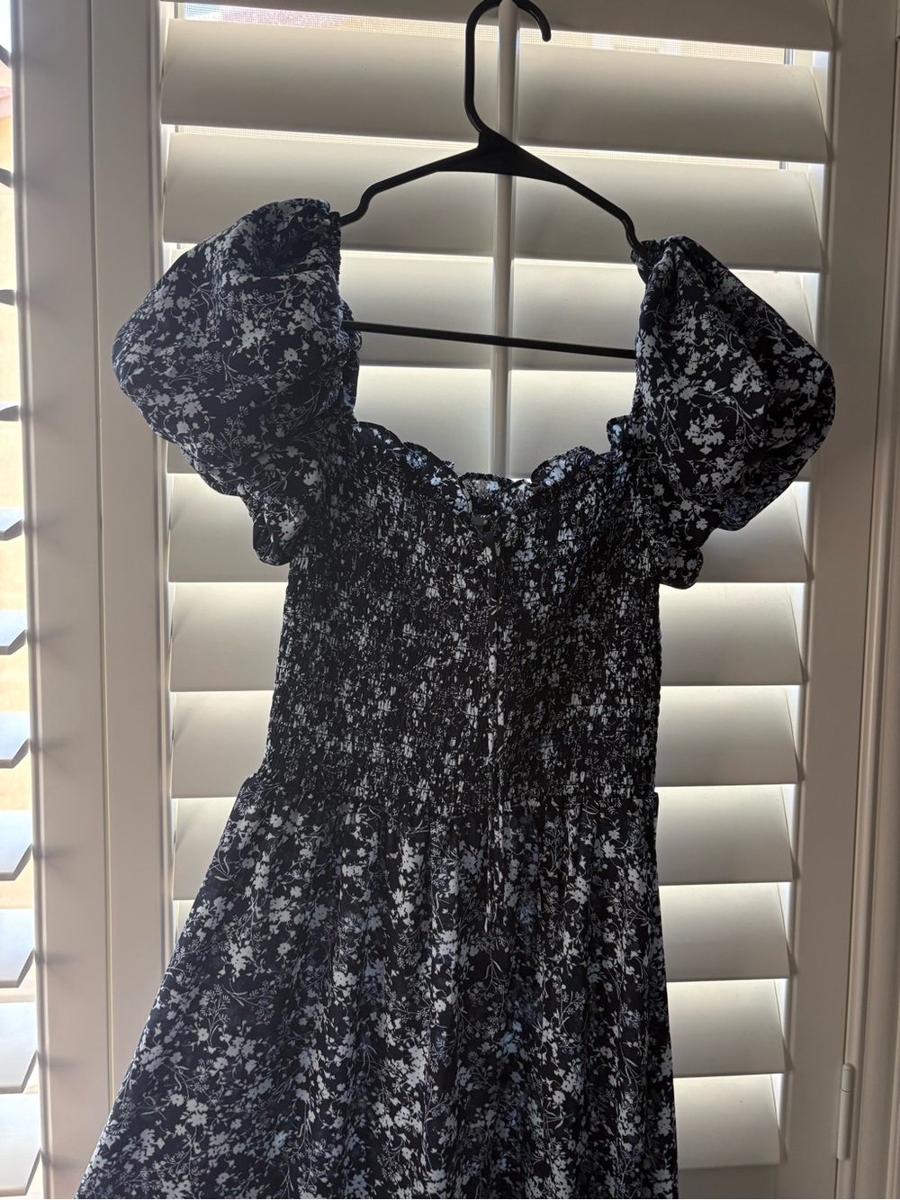 Francesca's Black and White Floral Smocked Top